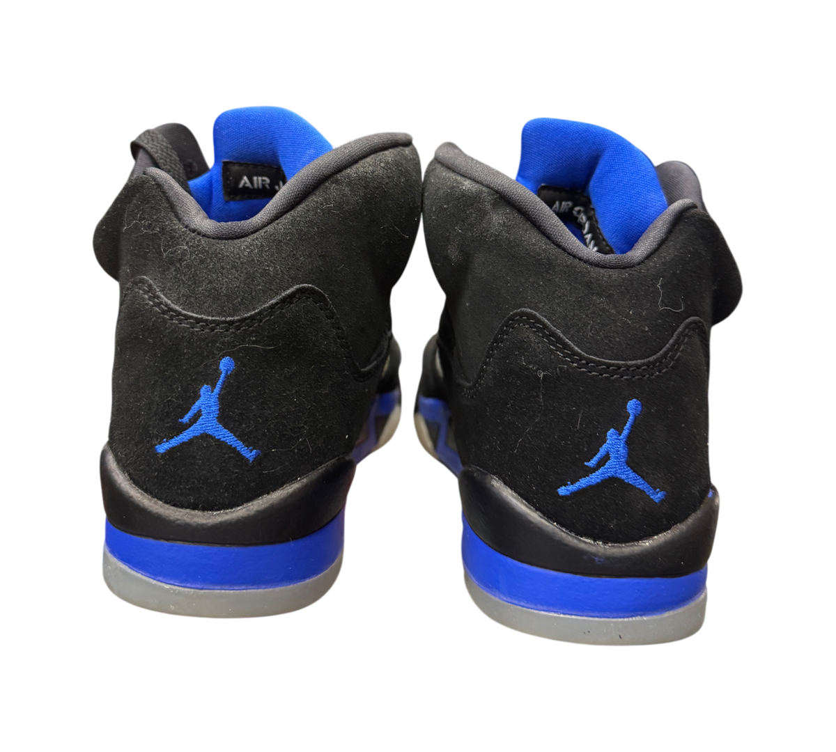 Genesis Boutique Jordan 5 GS Racer Blue sneakers featuring black suede uppers with blue Jumpman embroidery on heels