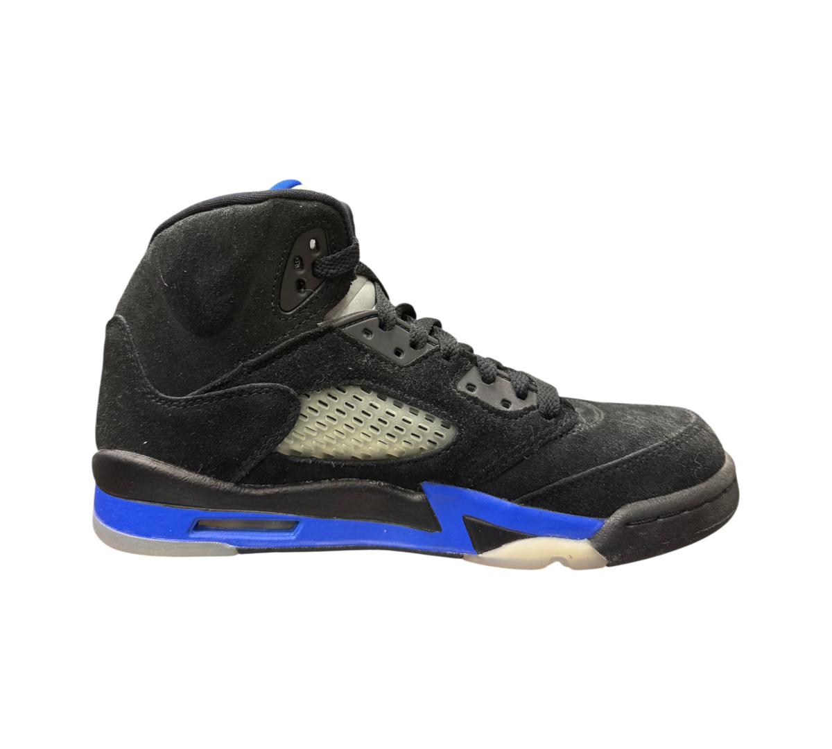 Genesis Boutique Jordan 5 GS Racer Blue sneakers in black suede with vibrant blue midsole accents and side netting.