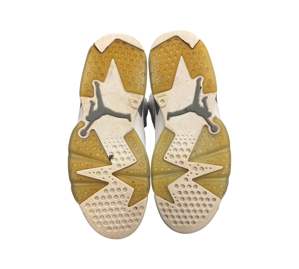 Genesis Boutique used Jordan 6 Cool Grey sneakers showing the worn translucent rubber outsoles with Jumpman logos.
