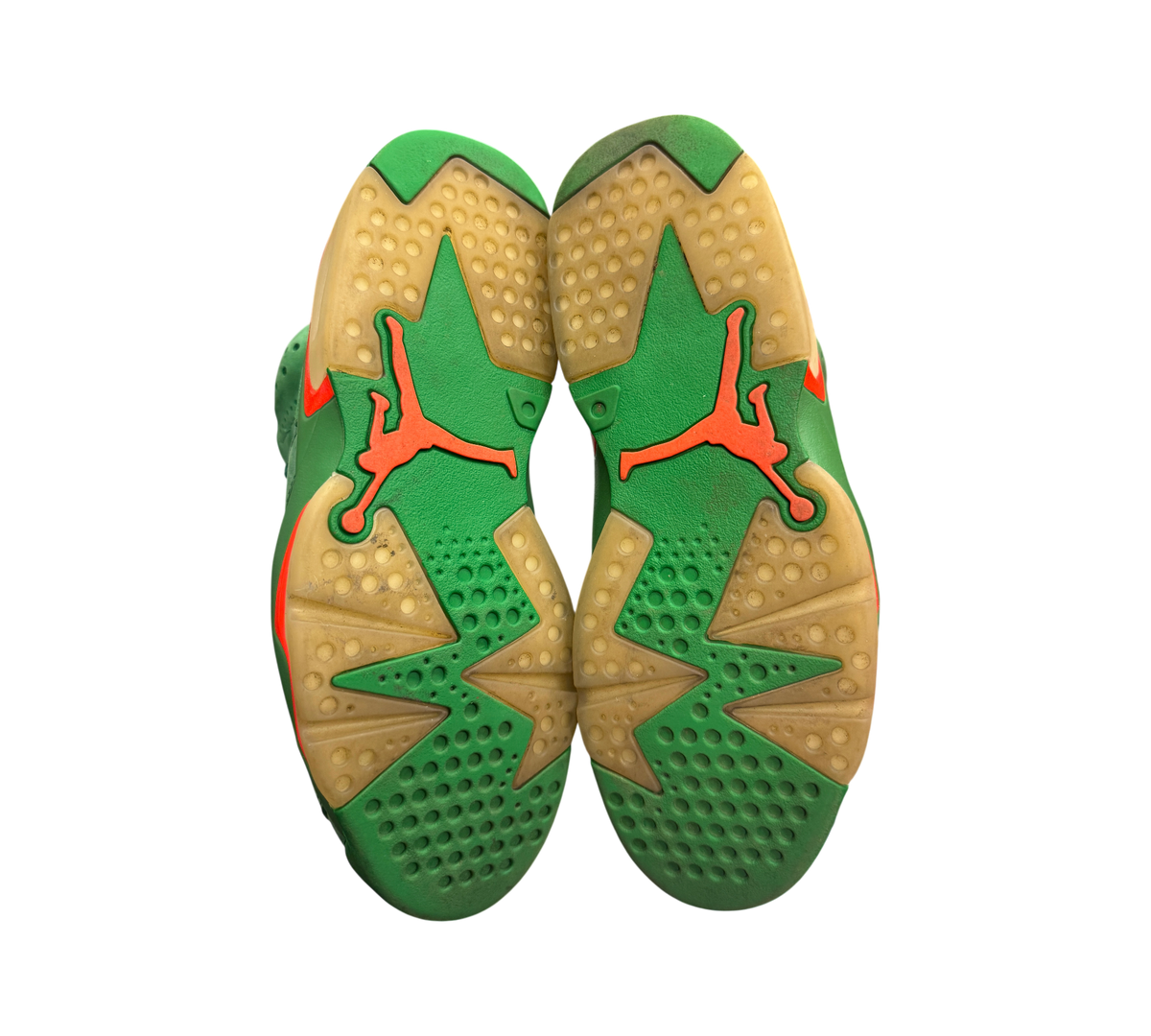 Genesis Boutique used Jordan 6 Gatorade Green sneakers showing the yellowed outsoles with orange Jumpman branding.