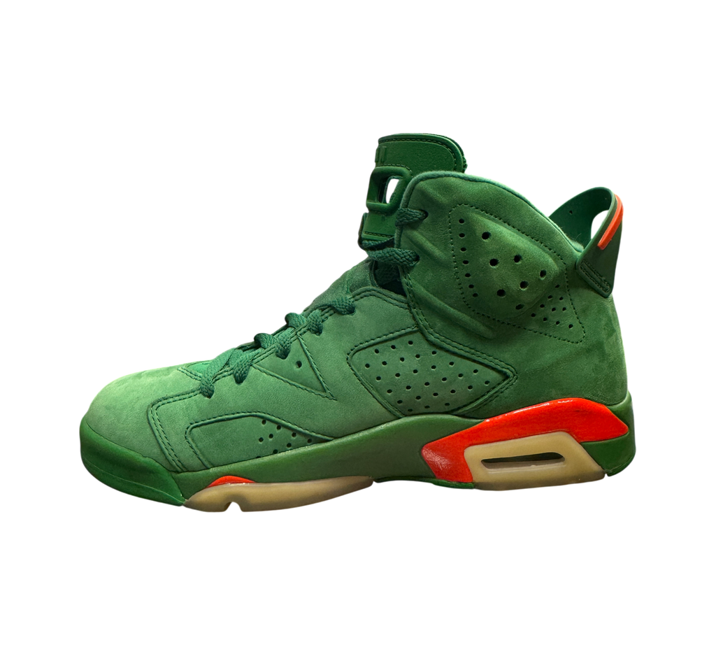 Genesis Boutique Jordan 6 Gatorade Green sneakers in suede with orange accents and yellowed soles, side profile view.