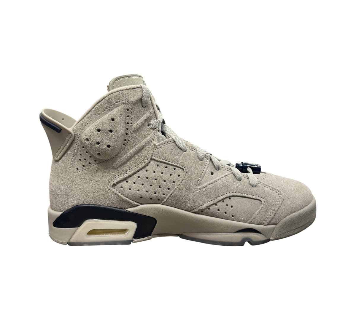 Genesis Boutique Jordan 6 Georgetown sneakers in grey suede with navy blue accents displayed on a glass shelf.