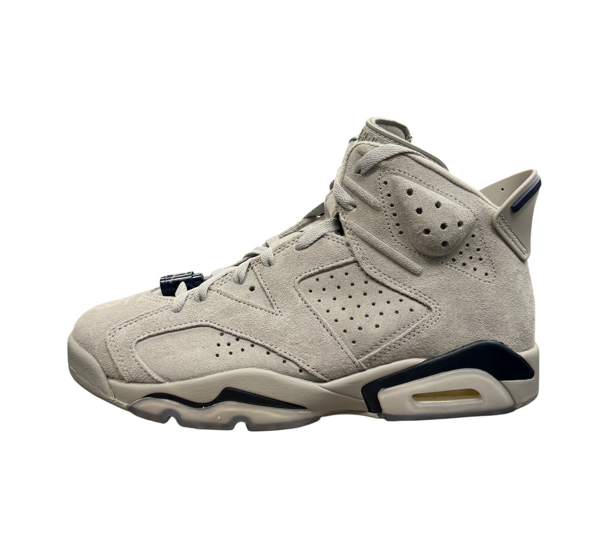 Genesis Boutique Jordan 6 Georgetown sneakers in grey suede with navy blue accents on a glass display case