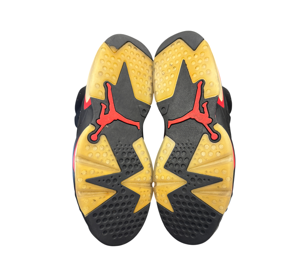 Genesis Boutique used Jordan 6 Infrared 2018 sneakers showing the black and yellowed translucent rubber outsoles