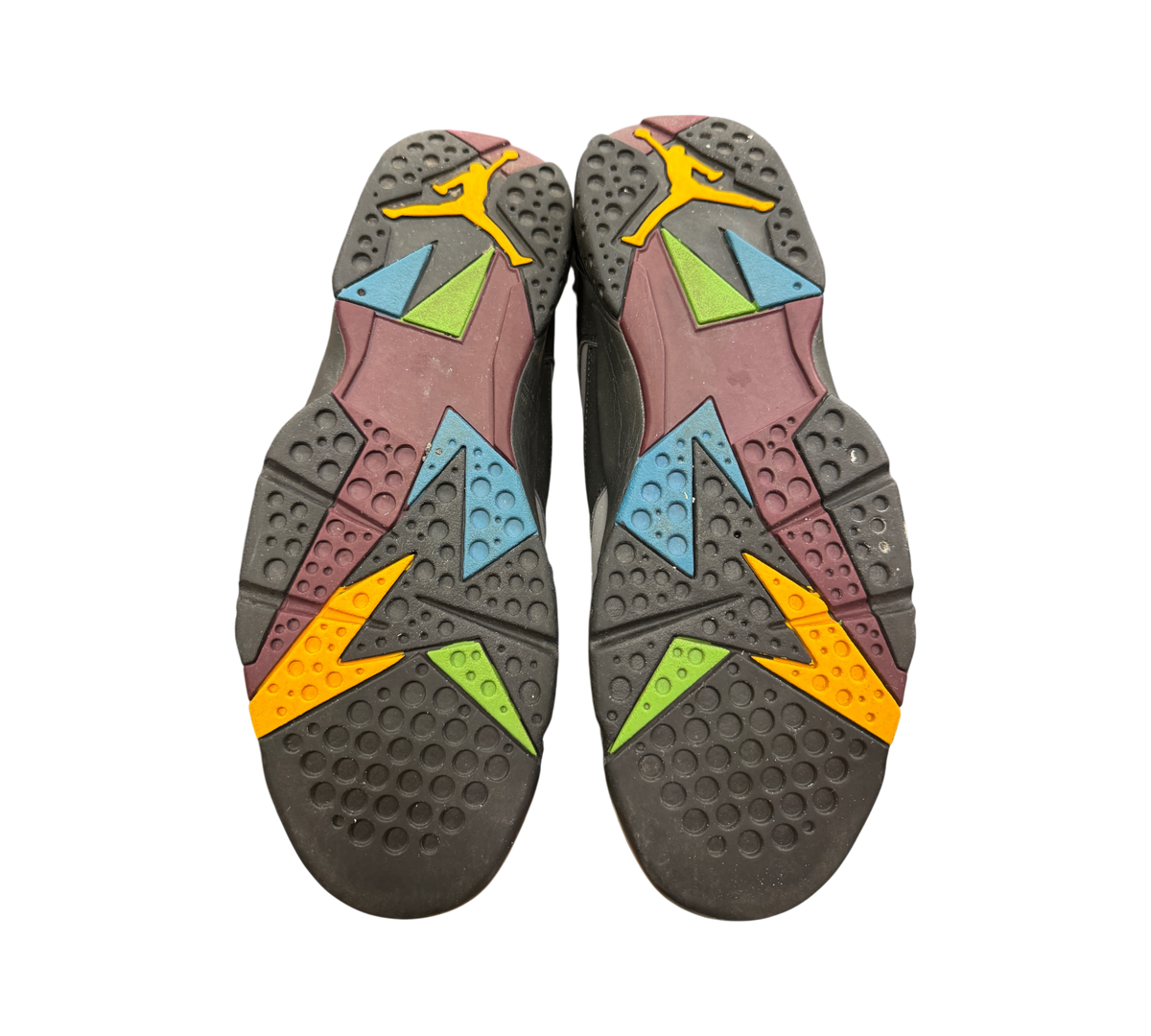 Genesis Boutique Jordan 7 Bordeaux sneaker outsoles featuring multi-colored geometric patterns in black, yellow, and blue