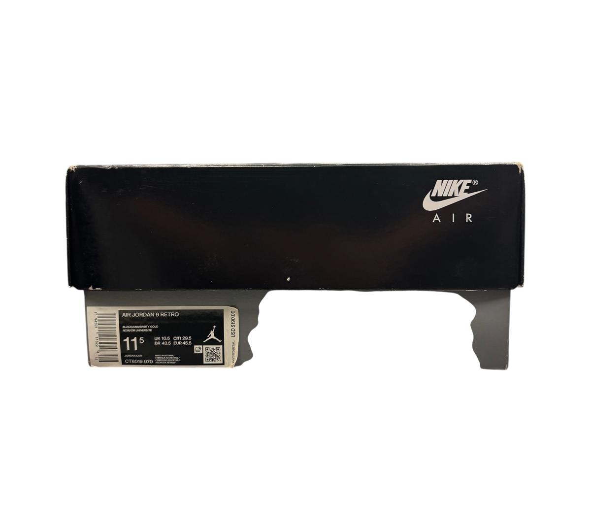 Genesis Boutique Jordan 9 Charcoal sneaker box with Nike Air branding on a glass display counter