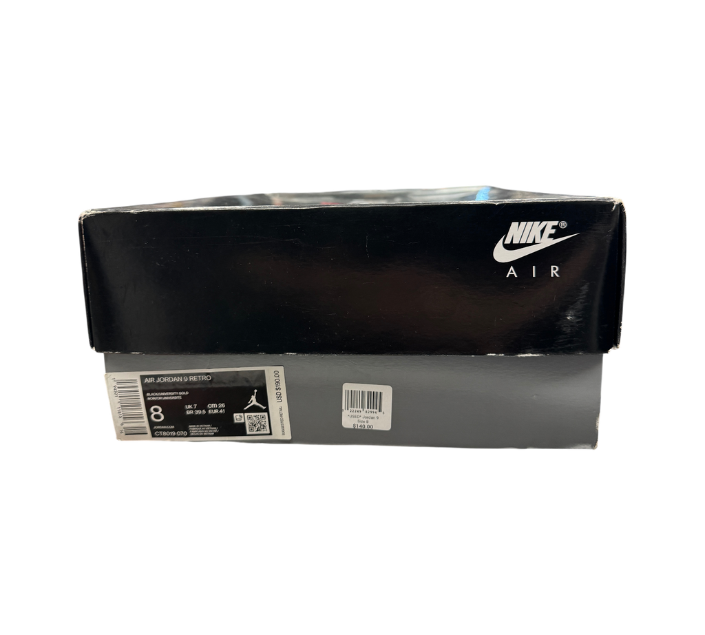 Genesis Boutique Jordan 9 Charcoal sneaker shoebox with Nike Air branding and size label on a glass display counter