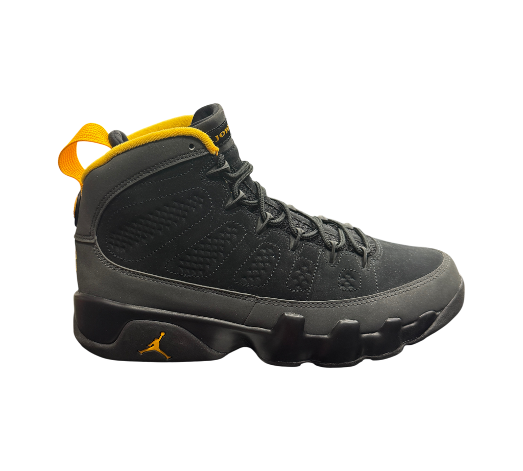 Genesis Boutique Jordan 9 Charcoal sneakers in black nubuck with yellow accents on a branded Jordan shoebox