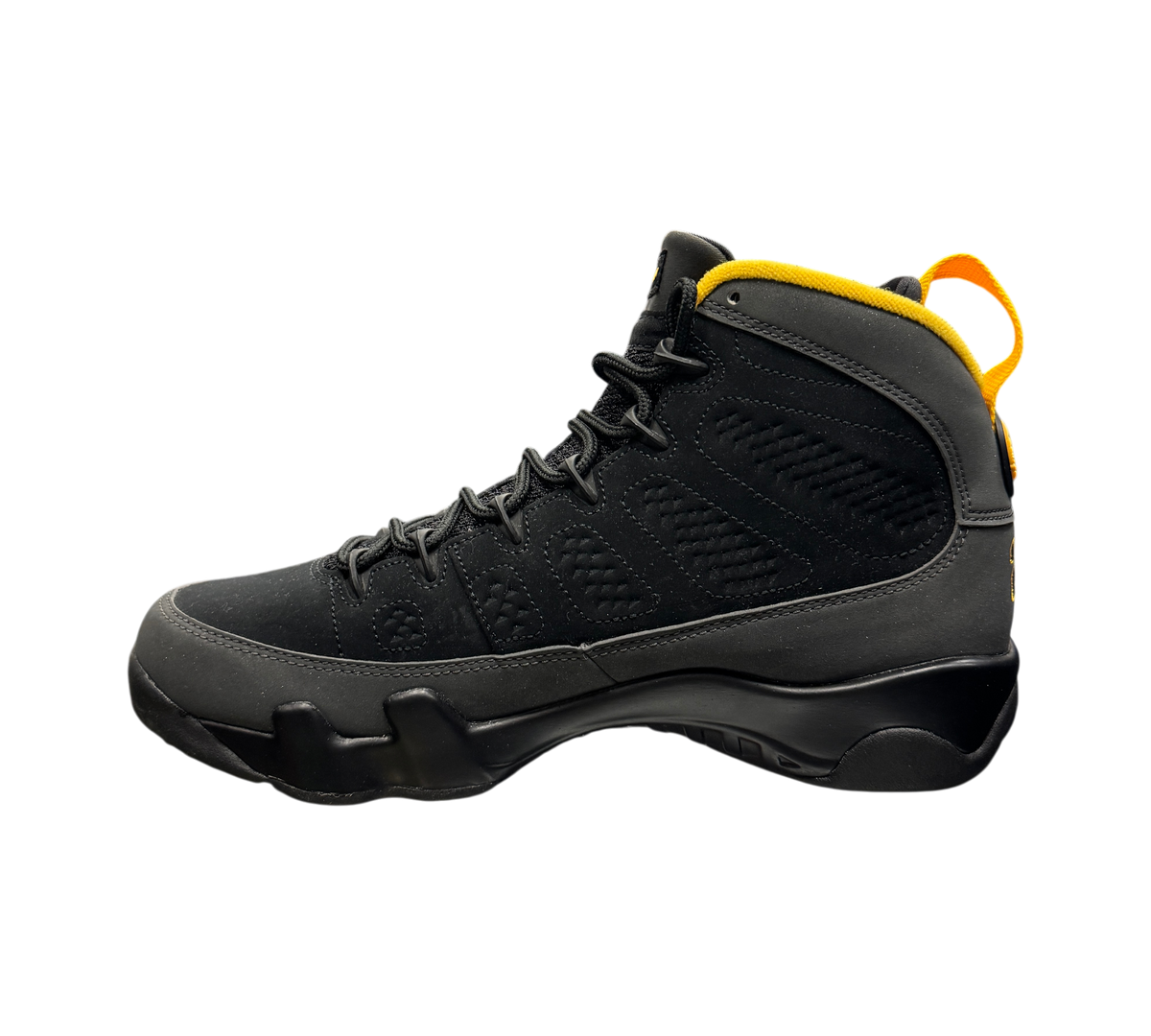 Genesis Boutique Jordan 9 Charcoal sneakers in black nubuck with yellow collar lining and heel pull tab
