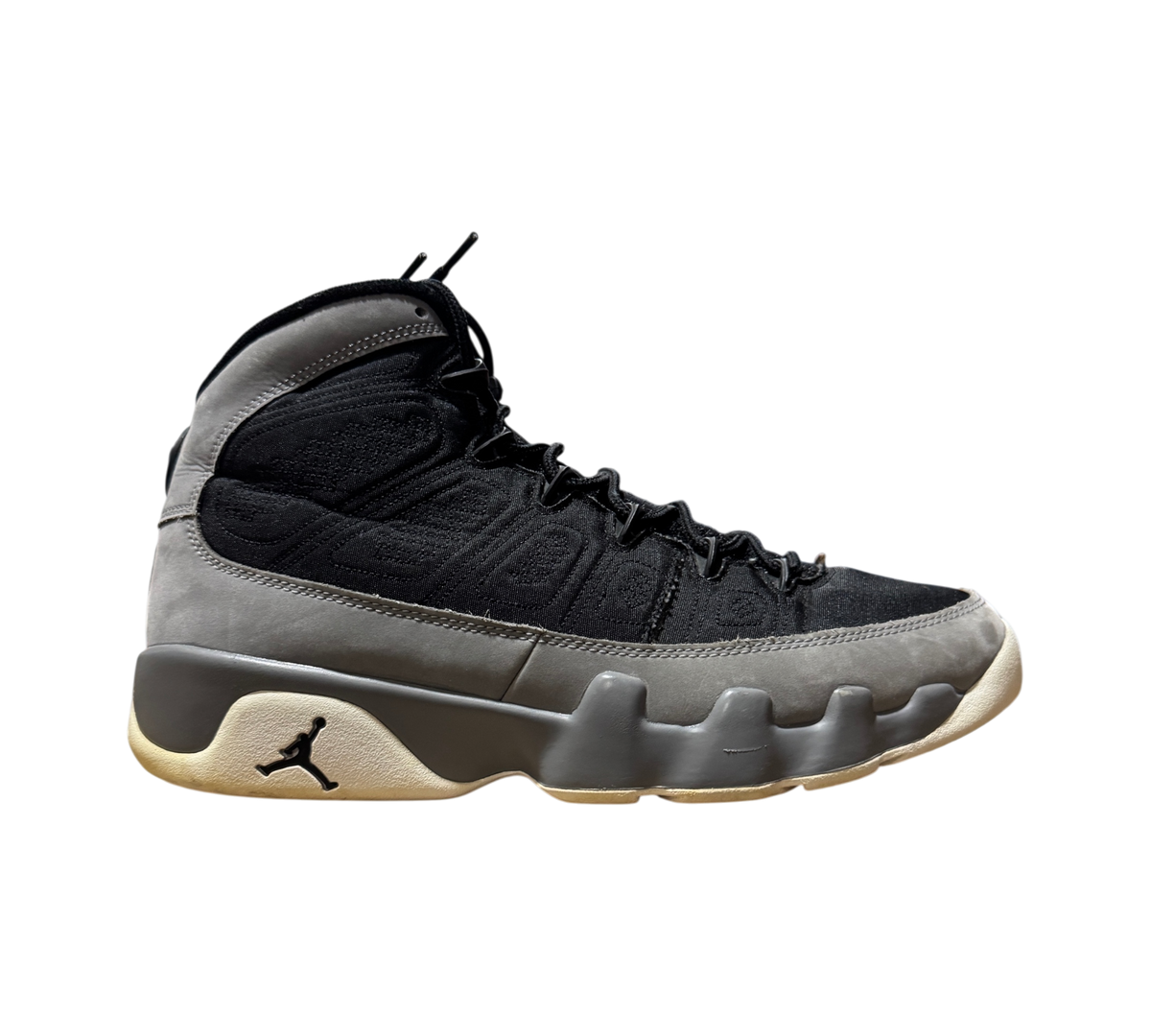 Genesis Boutique Jordan 9 Particle Grey high-top sneakers in black and grey suede with a Jumpman logo on the midsole.