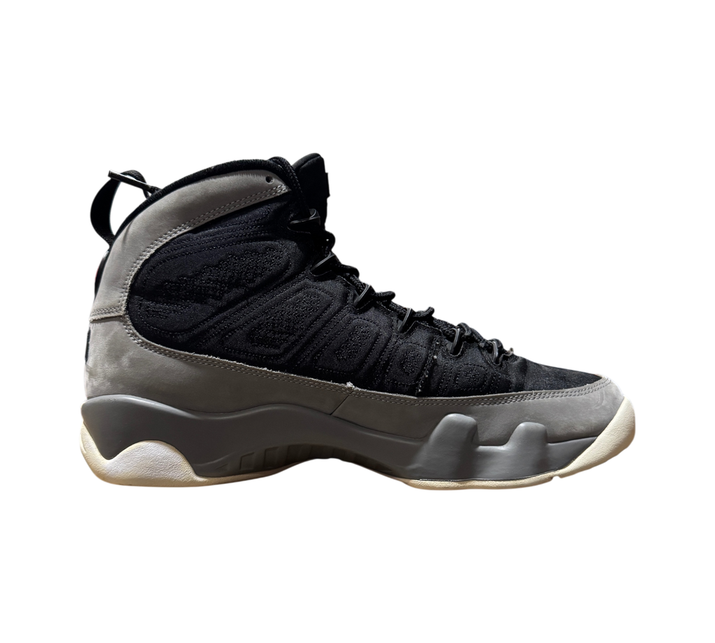 Genesis Boutique Jordan 9 Particle Grey sneaker in black and grey nubuck leather, side profile view.