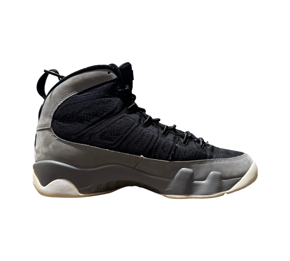 Genesis Boutique Jordan 9 Particle Grey sneaker in black and grey nubuck leather, side profile view.