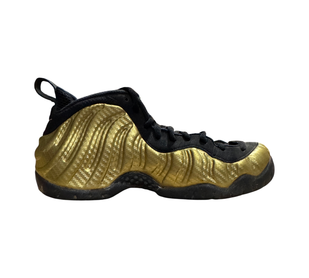 Genesis Boutique Nike Air Foamposite 1 Gold sneakers featuring a metallic gold molded upper and black accents.