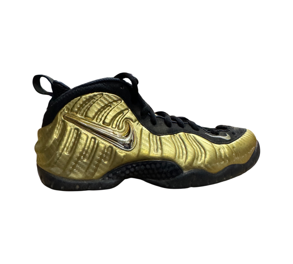 Genesis Boutique used Nike Air Foamposite 1 Gold sneakers featuring a metallic gold shell and black accents