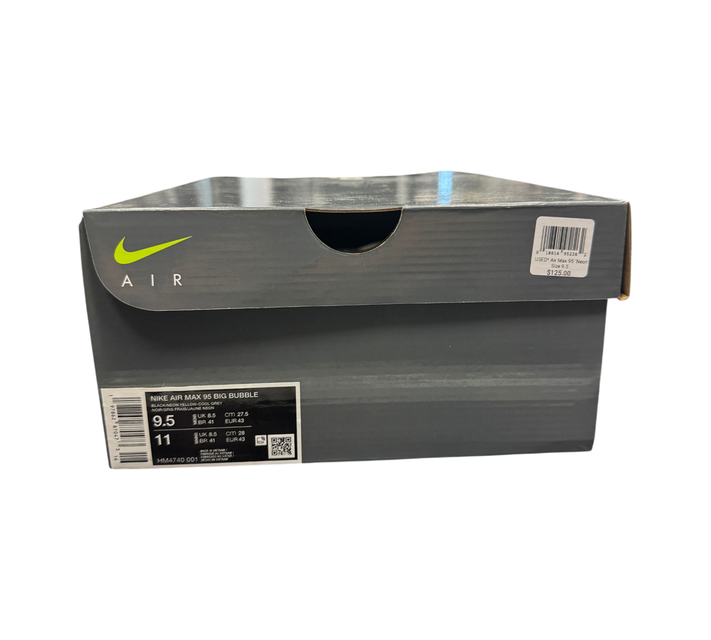 Genesis Boutique Nike Air Max 95 Neon Green shoe box with product label and price tag on a glass display counter