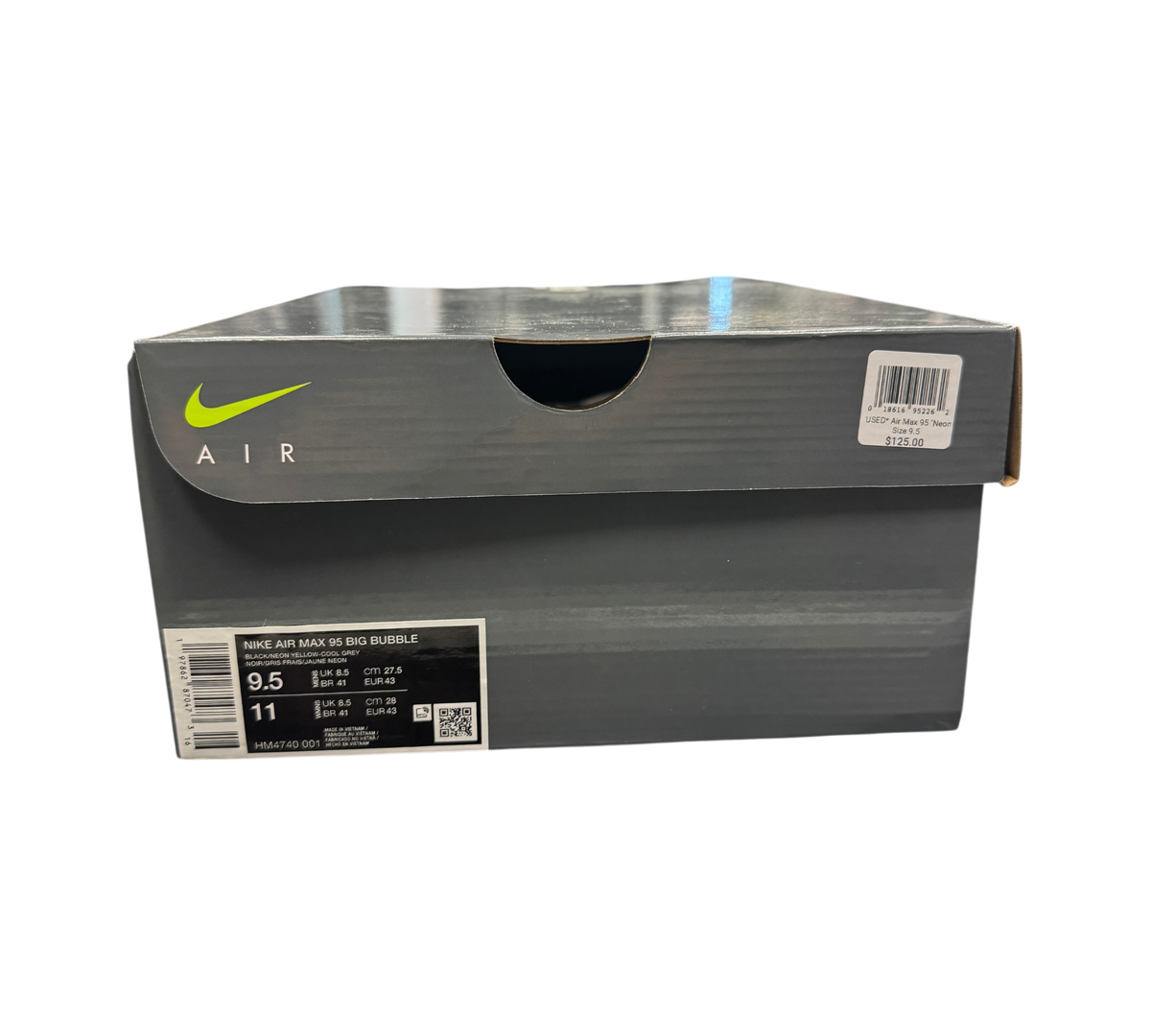 Genesis Boutique Nike Air Max 95 Neon Green shoe box with product label and price tag on a glass display counter