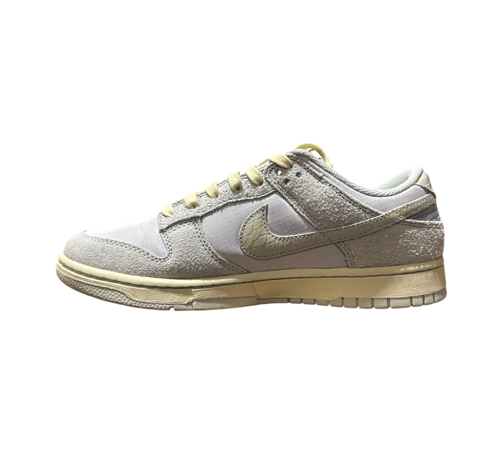 Genesis Boutique Nike Dunk Low Gone Fishing Chinook Salmon sneakers in light grey suede with yellowed vintage midsole