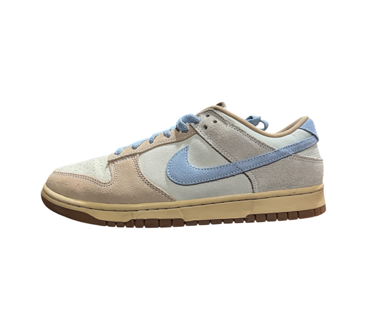 Genesis Boutique Nike Dunk Low Sanddrift Light Armory Blue sneakers featuring suede overlays and a gum rubber sole.