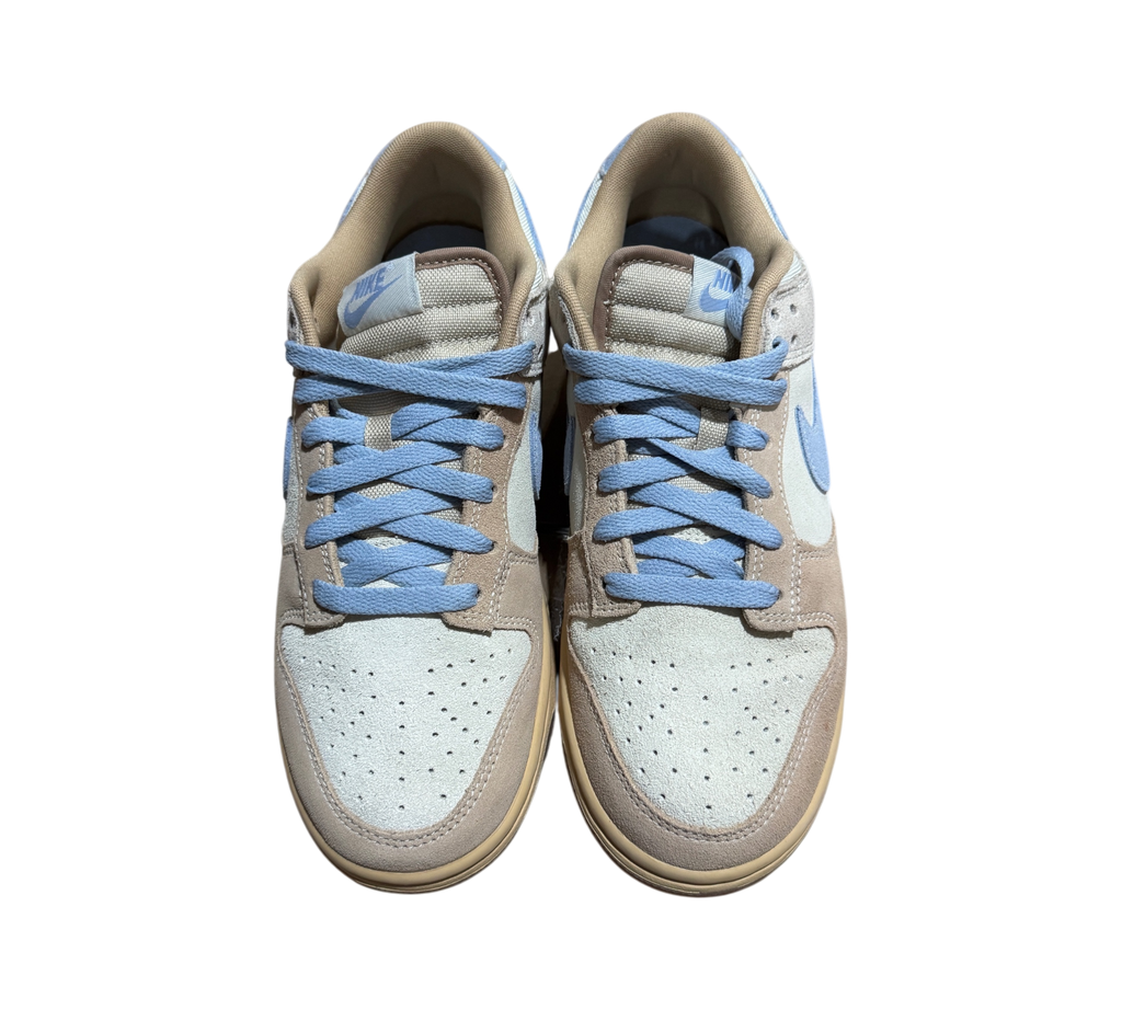 Genesis Boutique Nike Dunk Low Sanddrift Light Armory Blue sneakers with suede overlays and light blue laces