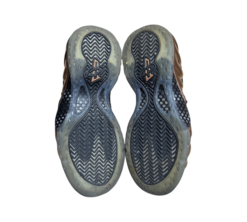 Genesis Boutique used Nike Air Foamposite 1 Copper sneakers showing the black herringbone tread rubber outsoles