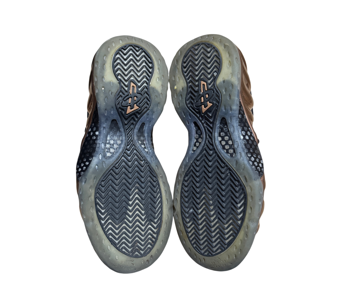 Genesis Boutique used Nike Air Foamposite 1 Copper sneakers showing the black herringbone tread rubber outsoles