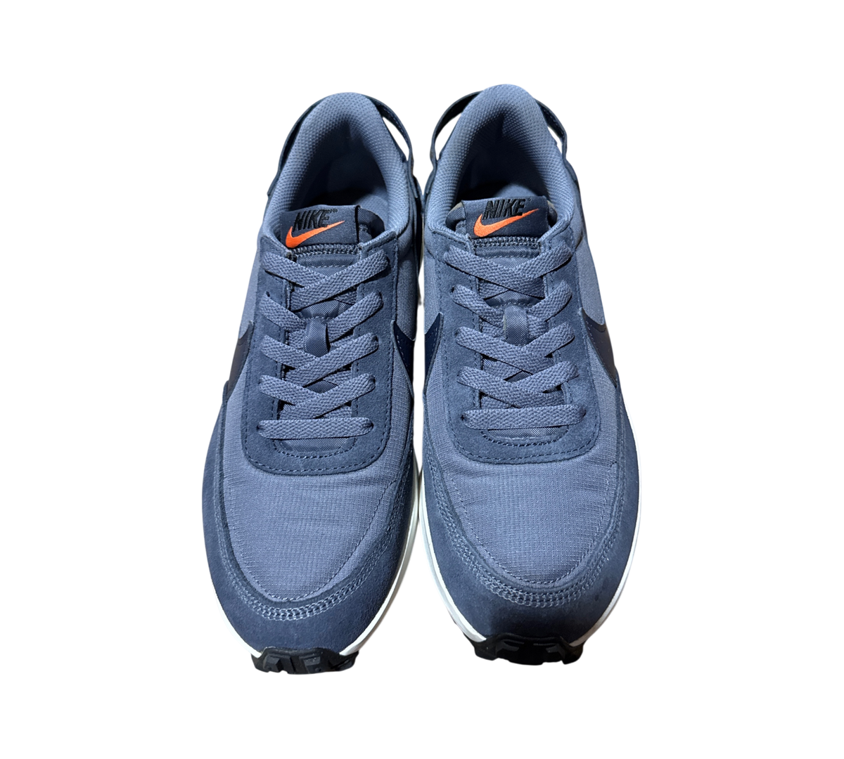 Genesis Boutique used Nike Waffle Debut SE sneakers in light carbon and obsidian blue with orange logo accents