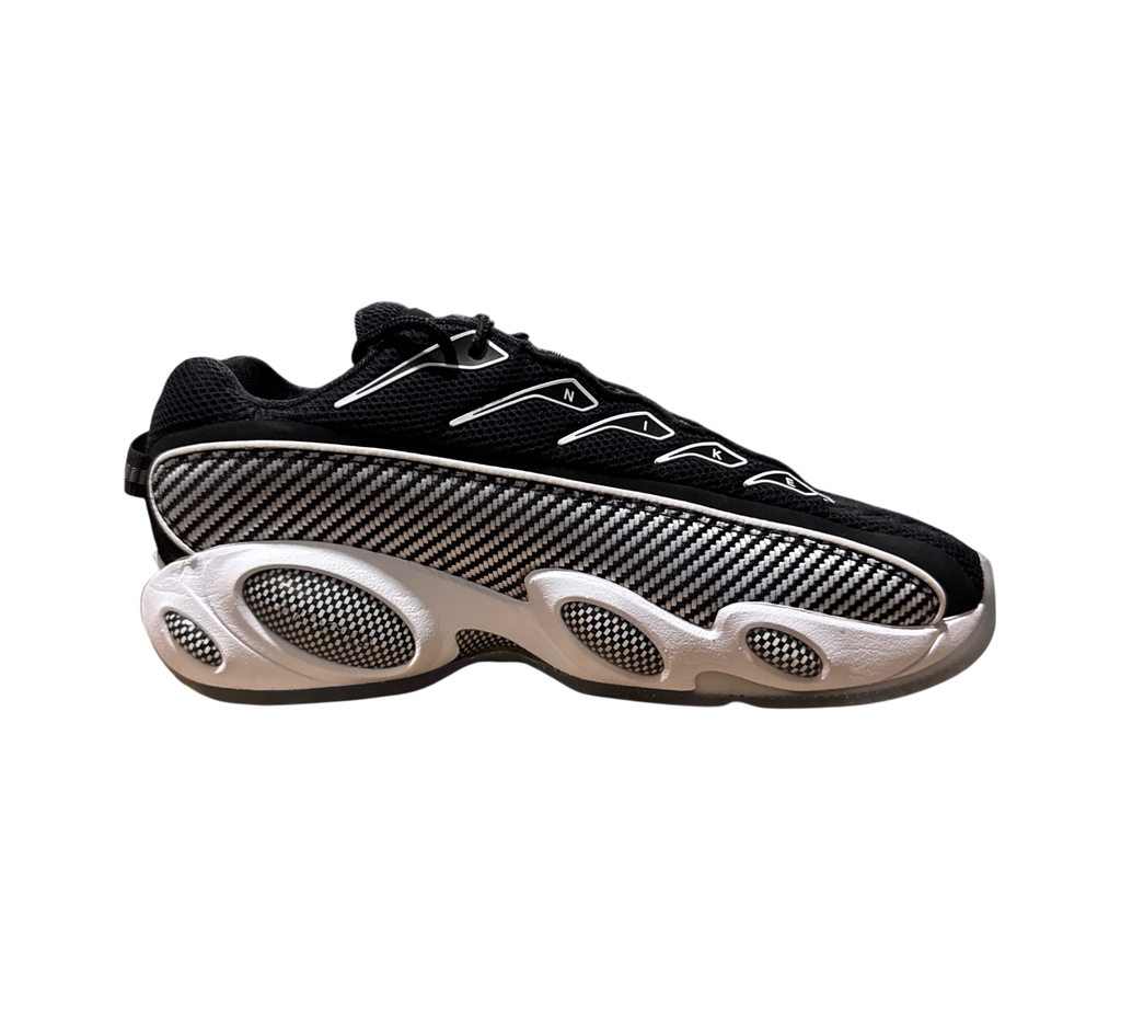 Genesis Boutique NOCTA x Nike Glide sneakers in black and white with carbon fiber pattern side panels