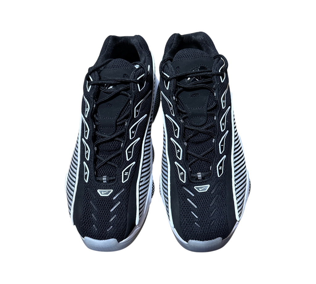 Genesis Boutique pre-owned NOCTA x Nike Glide sneakers in black and white with mesh detailing and lace-up closure.