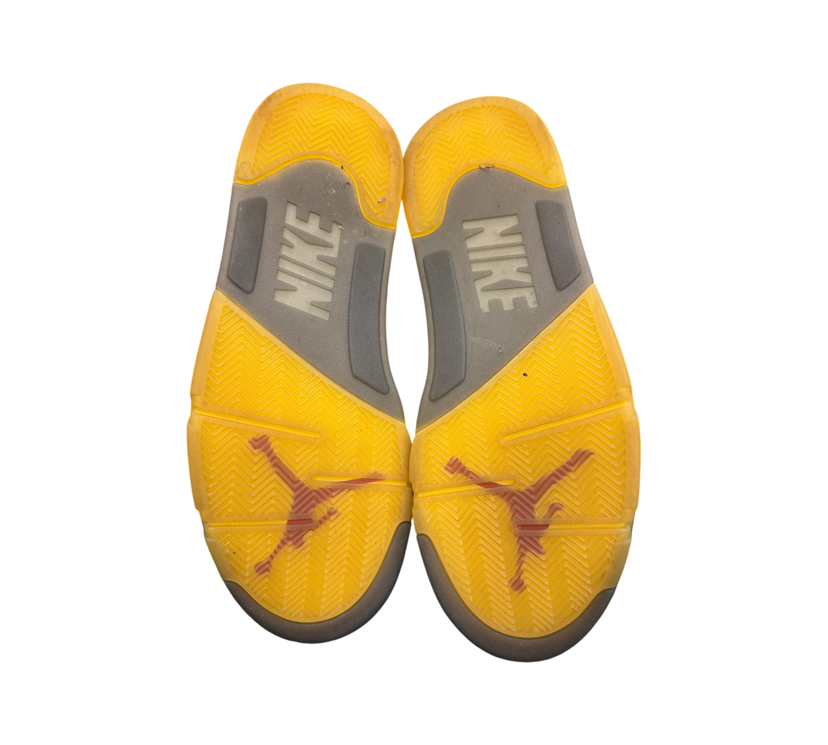 Genesis Boutique used Off-White Jordan 5 Sail sneakers showing yellowed translucent rubber outsoles with Nike branding