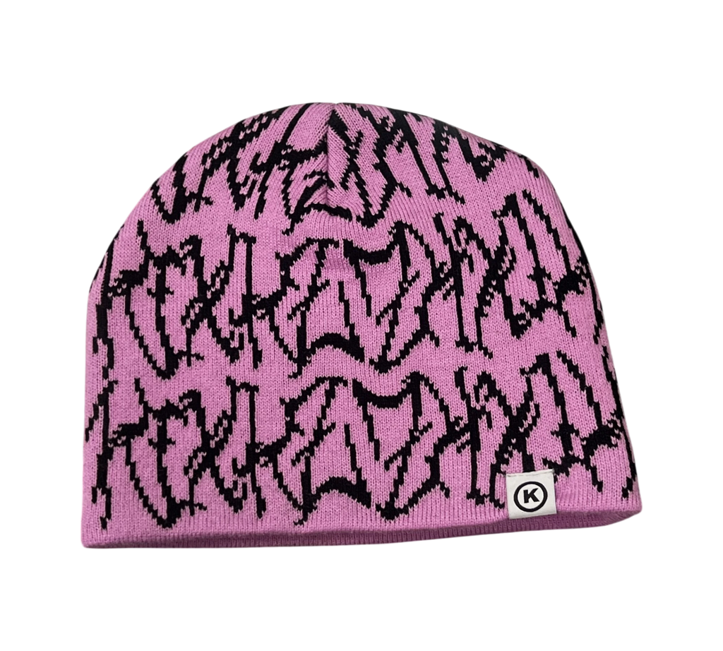 Genesis Boutique pink knit beanie with black jagged graphic pattern and white circular logo patch.