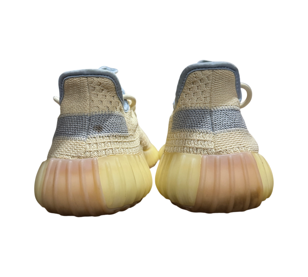 Genesis Boutique used Yeezy 350 Linen sneakers featuring a pale yellow knit upper and translucent gum rubber soles.
