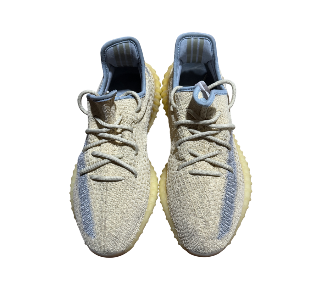 Genesis Boutique pre-owned Yeezy 350 Linen sneakers featuring a pale yellow knit upper and grey side stripe