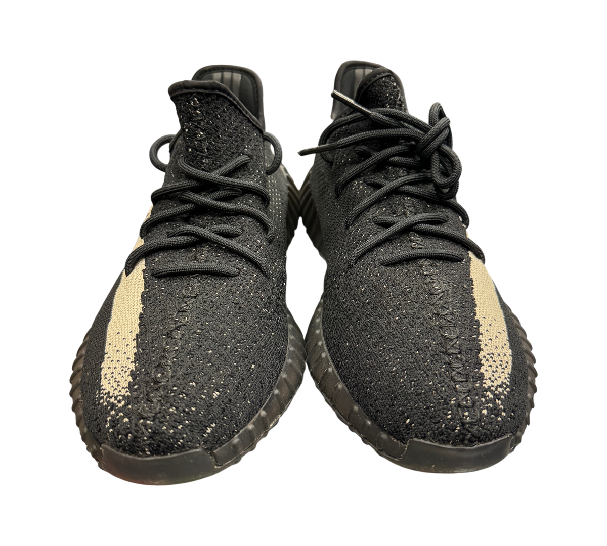 Genesis Boutique Yeezy 350 Oreo sneakers in black Primeknit with a white side stripe, front view.