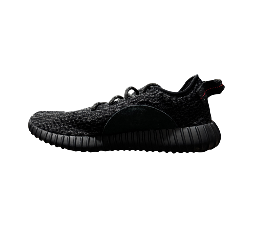 Genesis Boutique Yeezy 350 Pirate Black 2023 sneaker in black Primeknit with red heel tab stitching, side profile view