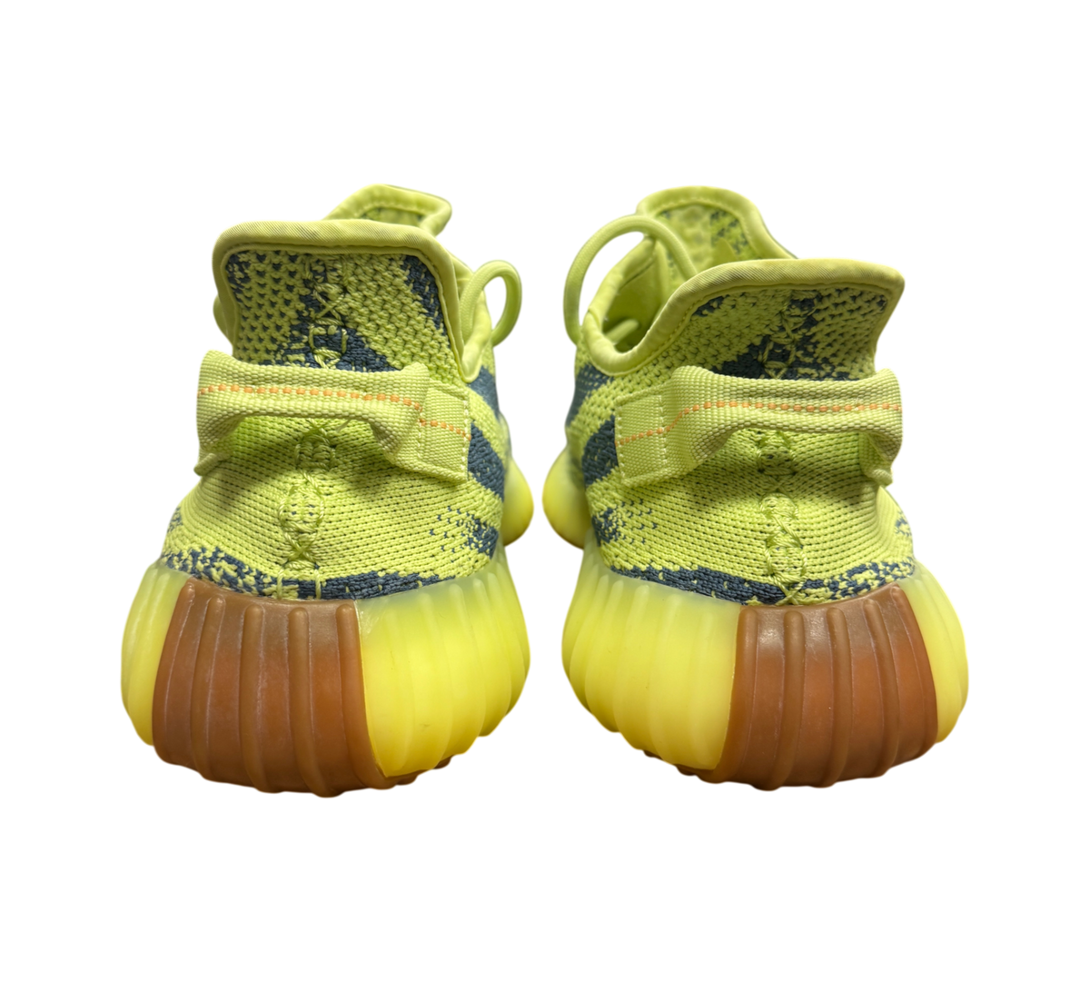Genesis Boutique Yeezy 350 Semi Frozen Yellow sneakers showing the heel view with yellow soles and knit texture