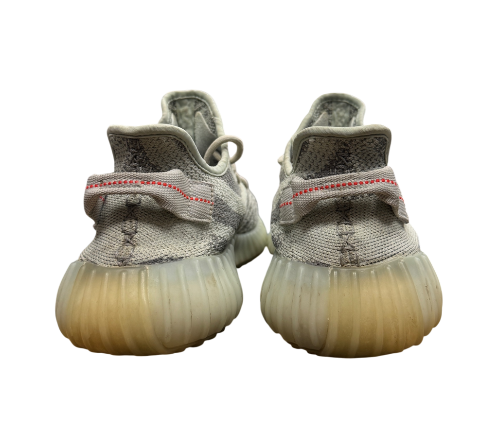 Genesis Boutique pre-owned Yeezy 350 V2 Blue Tint sneakers showing the rear heel view with signature red stitching.