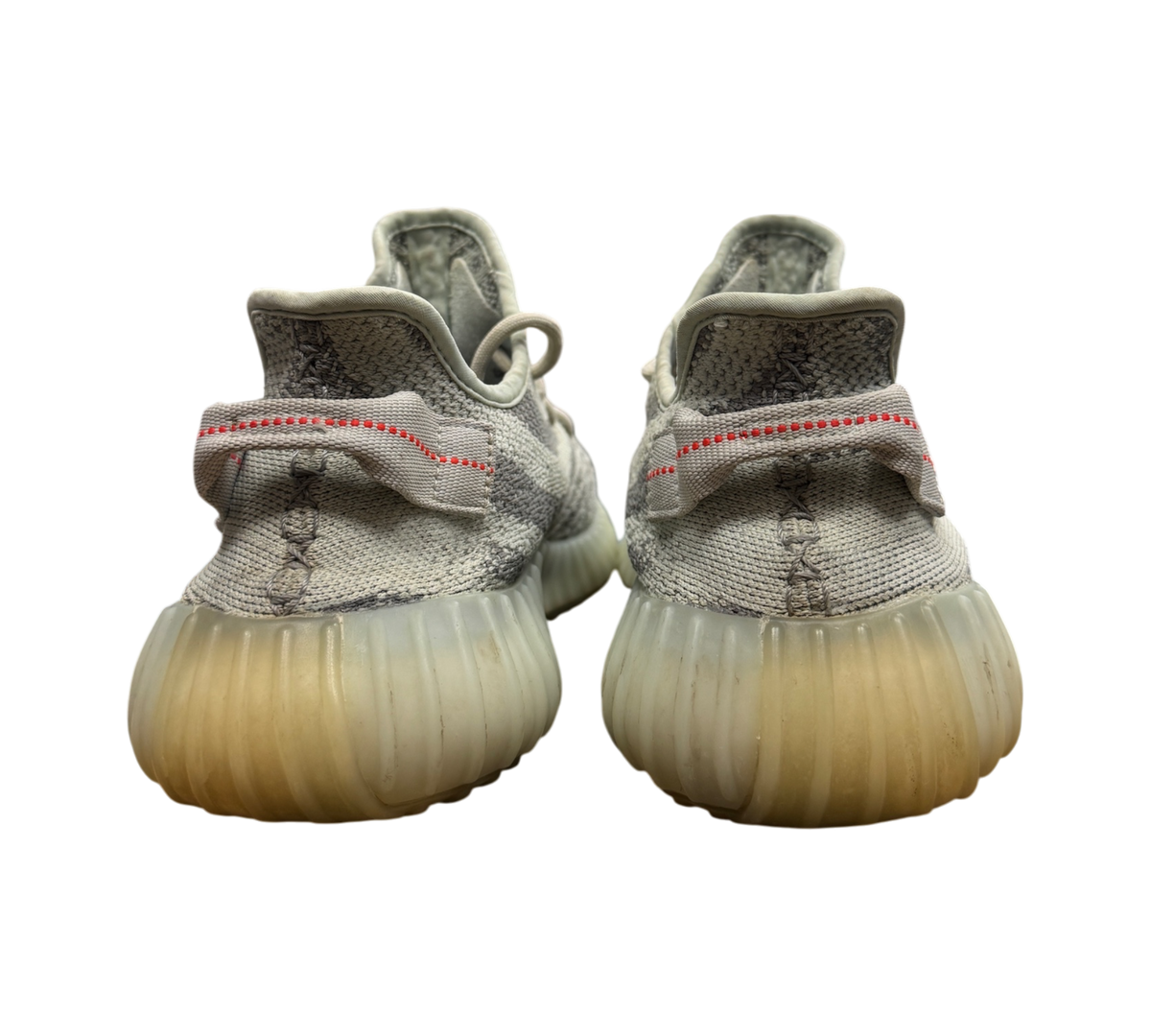 Genesis Boutique pre-owned Yeezy 350 V2 Blue Tint sneakers showing the rear heel view with signature red stitching.