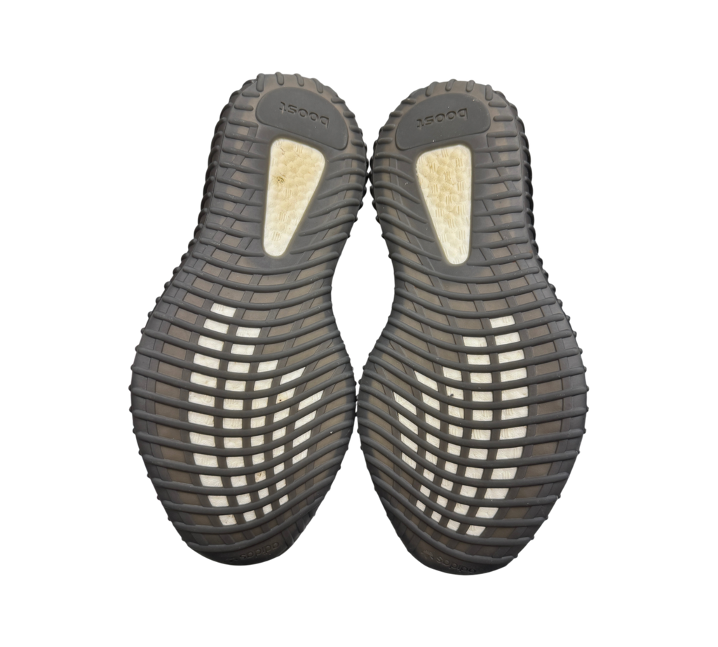 Genesis Boutique used Yeezy 350 V2 Bred sneakers showing the black rubber outsoles with white Boost cushioning