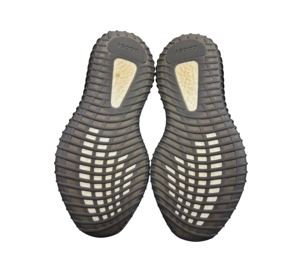 Genesis Boutique used Yeezy 350 V2 Bred sneakers showing the black rubber outsoles with white Boost cushioning