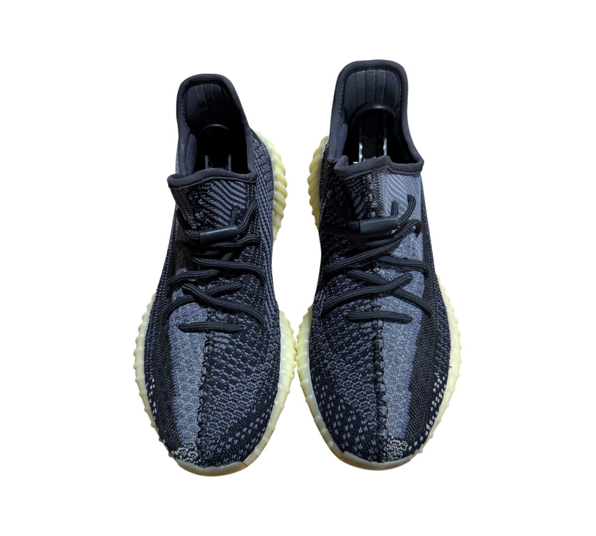 Genesis Boutique pre-owned Yeezy 350 V2 Carbon sneakers featuring a grey and black Primeknit upper and yellowed sole.