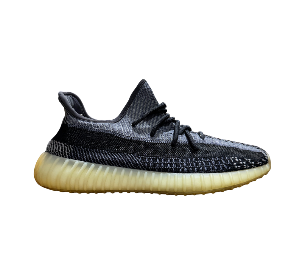 Genesis Boutique used Yeezy 350 V2 Carbon sneakers featuring a grey and black knit upper and yellowed rubber sole.