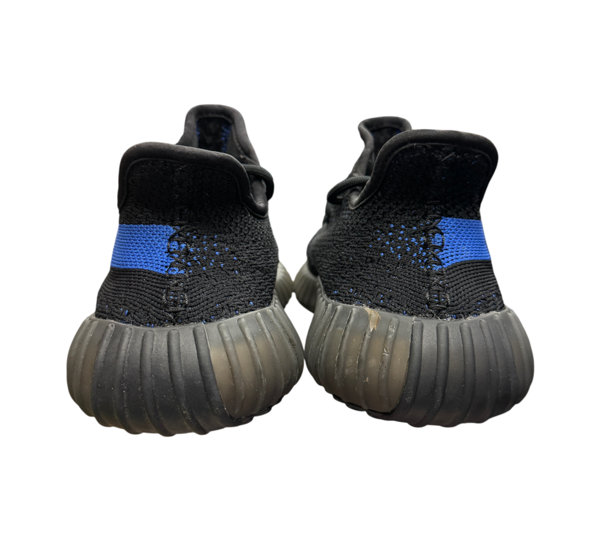 Genesis Boutique Yeezy 350 V2 Dazzling Blue sneakers showing black knit uppers with blue stripe detail from rear view