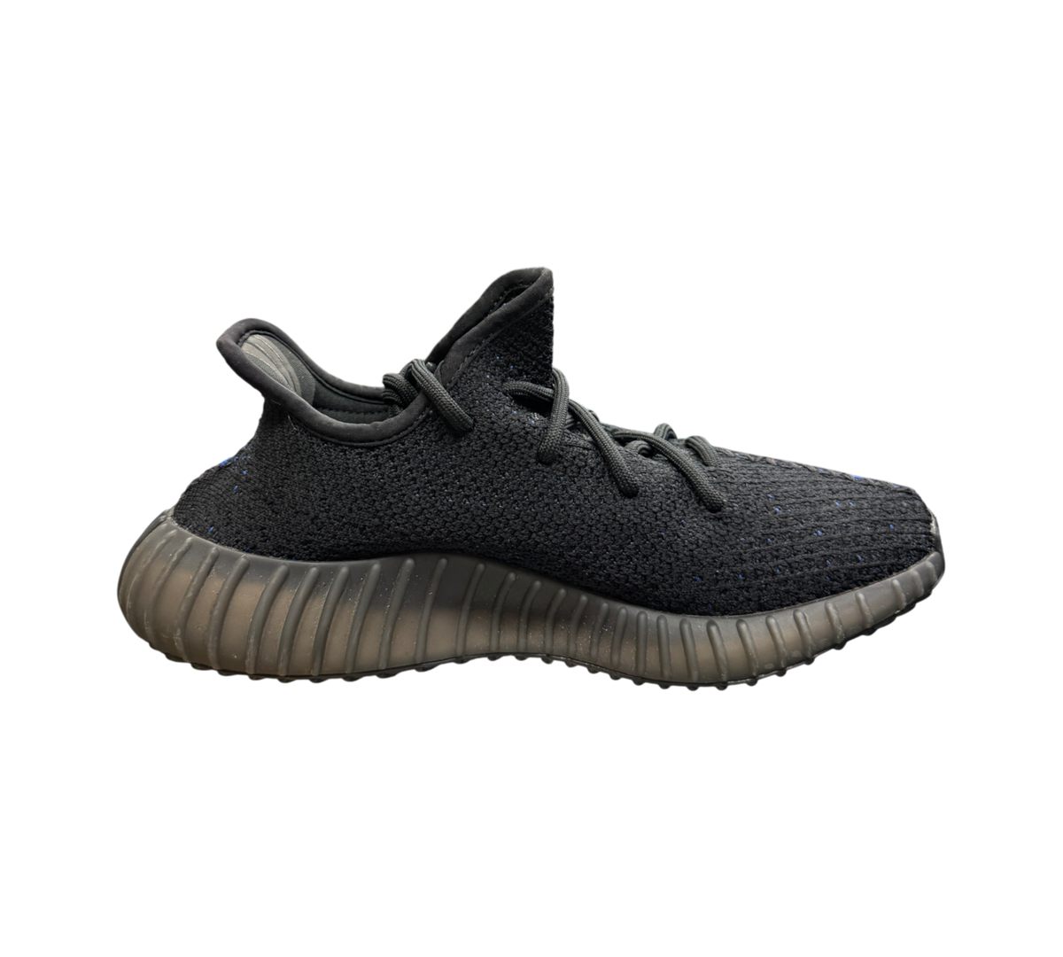 Genesis Boutique Yeezy 350 V2 Dazzling Blue sneaker in black knit with blue stripe detail on a glass display table