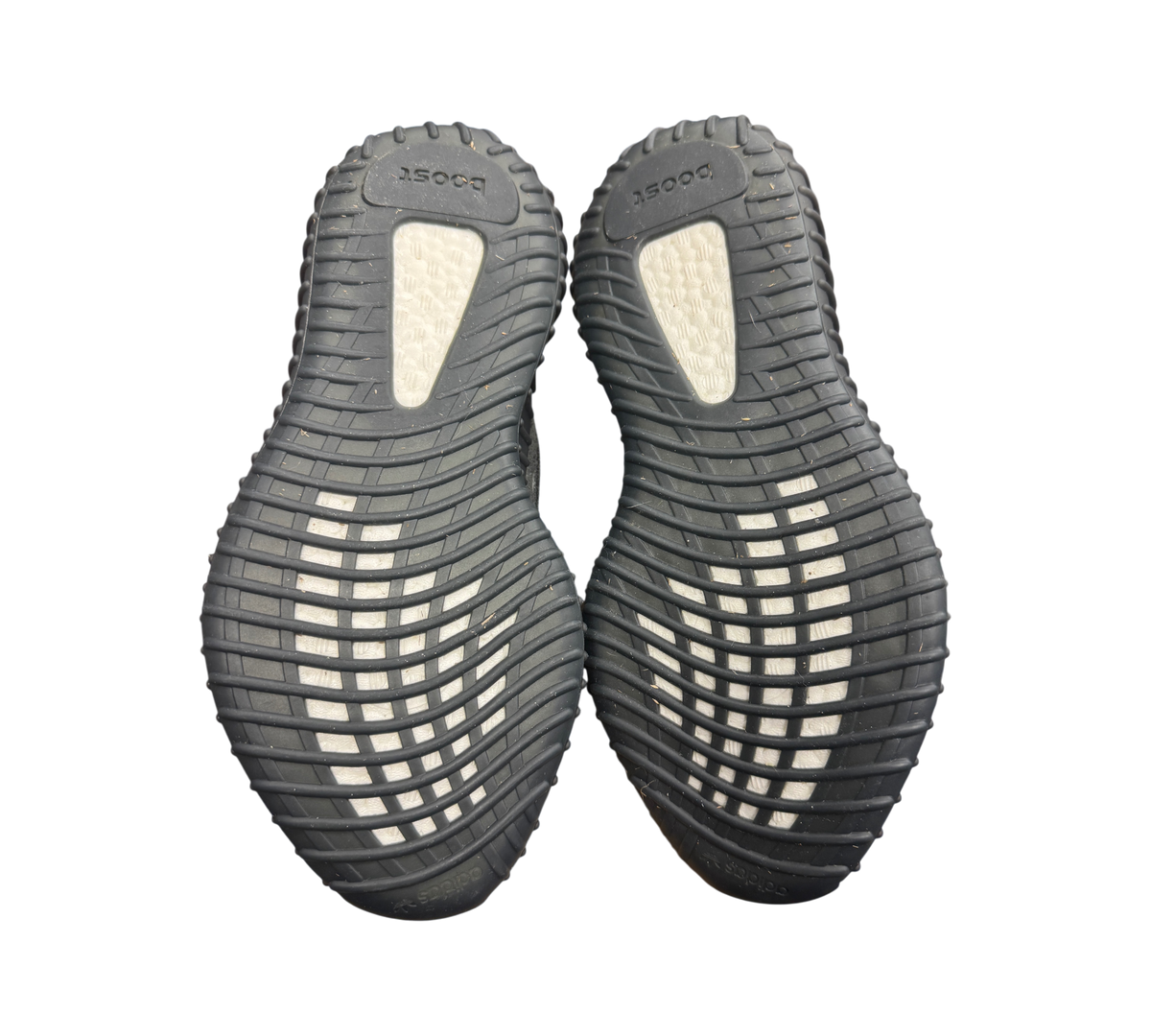 Genesis Boutique used Yeezy 350 V2 MX Dark Salt sneakers showing the black rubber outsoles with white Boost cushioning
