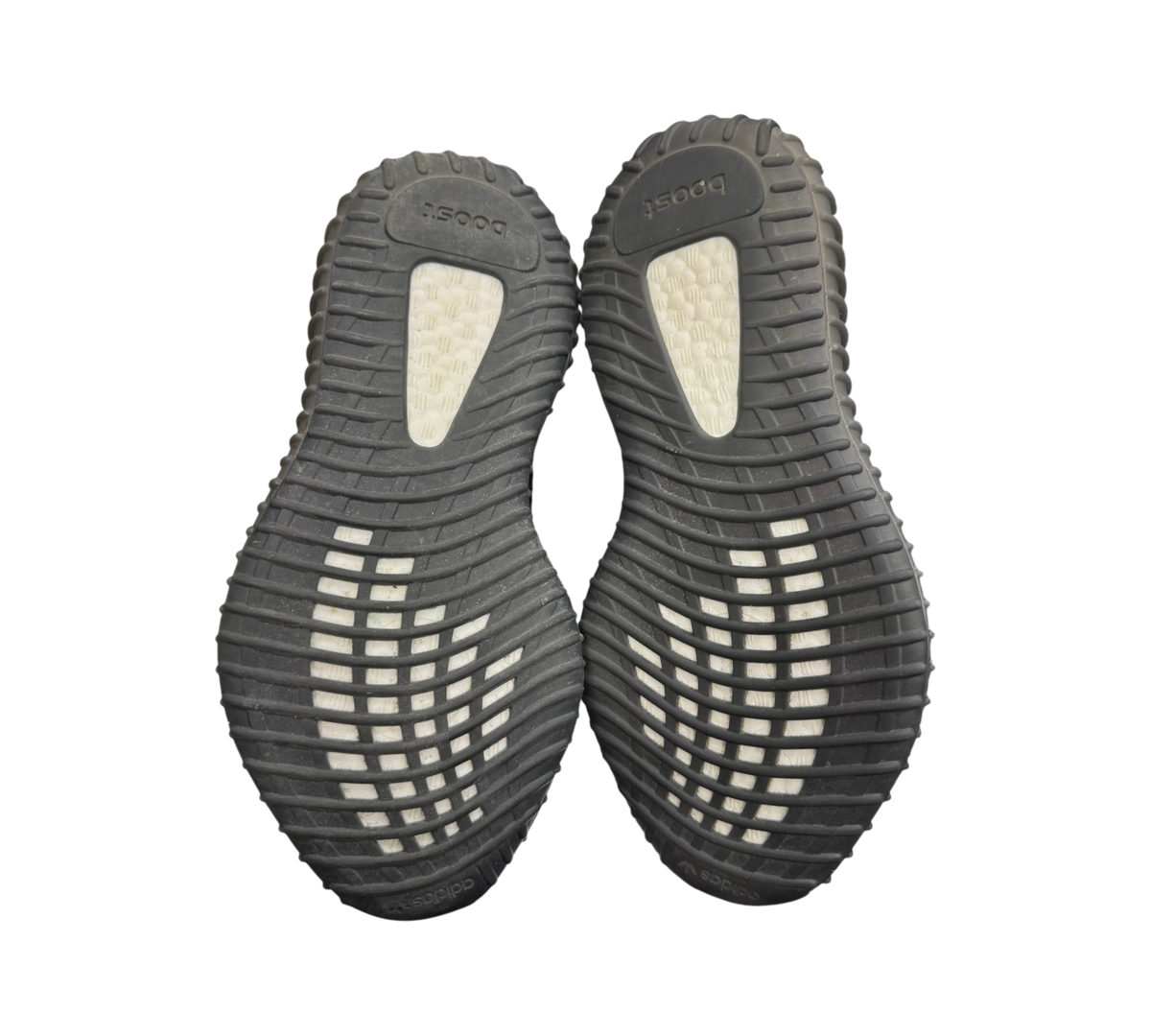 Genesis Boutique used Yeezy 350 V2 Dazzling Blue sneakers showing black rubber outsoles with white Boost cushioning