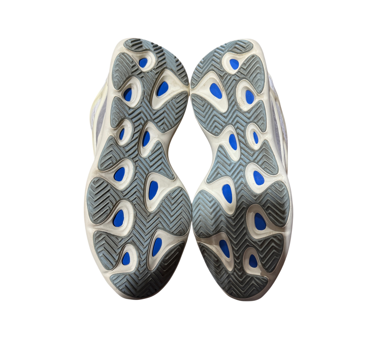 Genesis Boutique used Yeezy 700 Azael sneakers showing the beige and blue patterned rubber outsoles from below