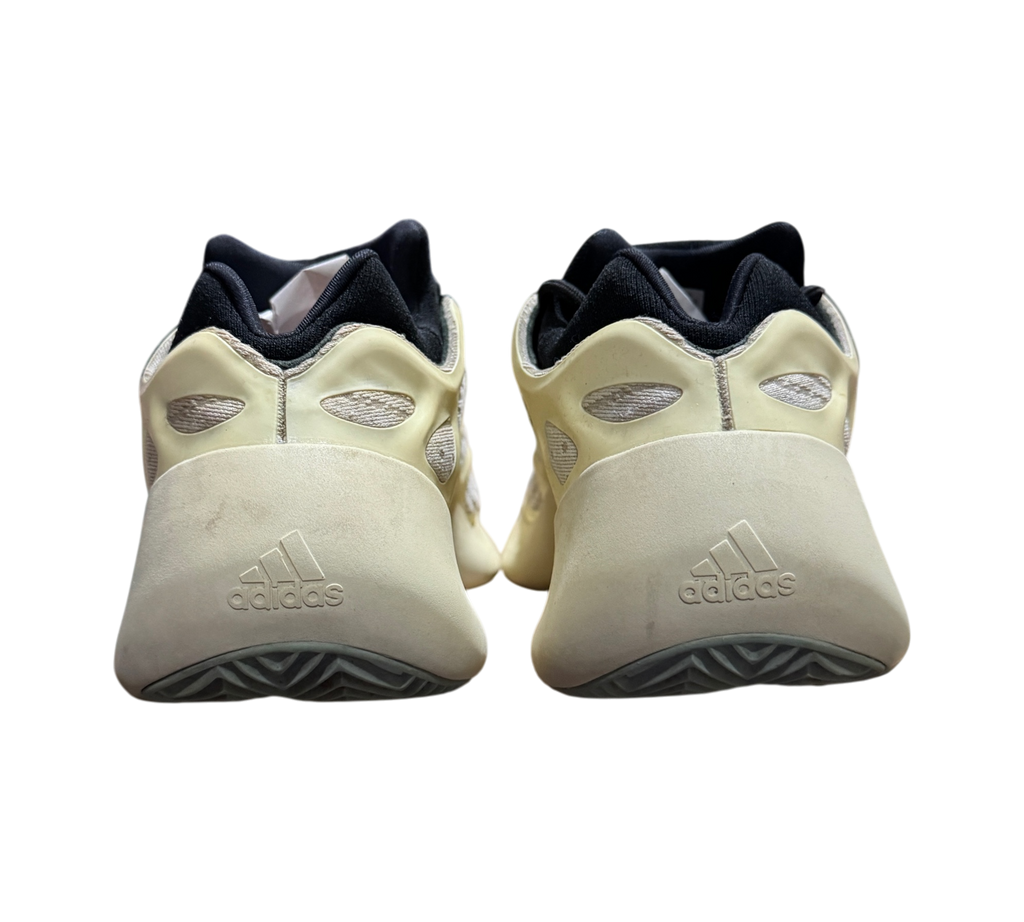 Genesis Boutique used Yeezy 700 Azael sneakers showing the off-white heel and black collar from a rear perspective.