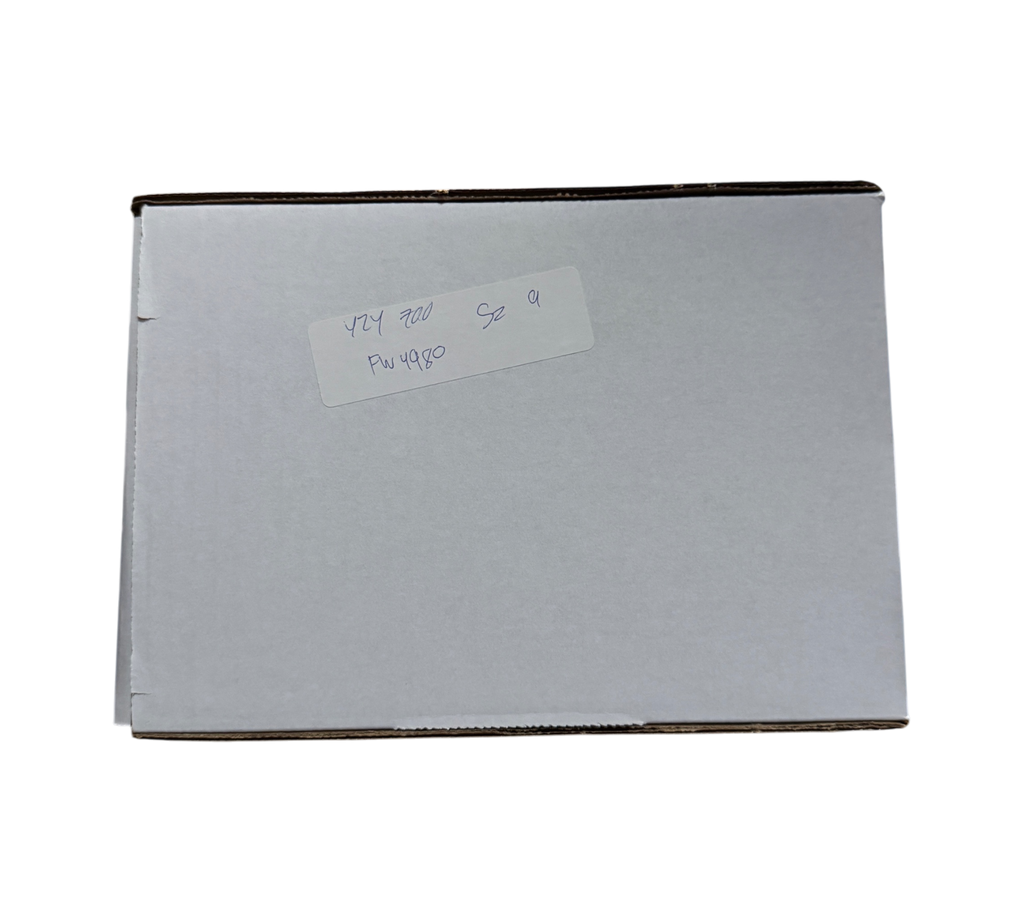 Genesis Boutique white cardboard shipping box with handwritten label for Yeezy 700 Azael size 9 in a warehouse