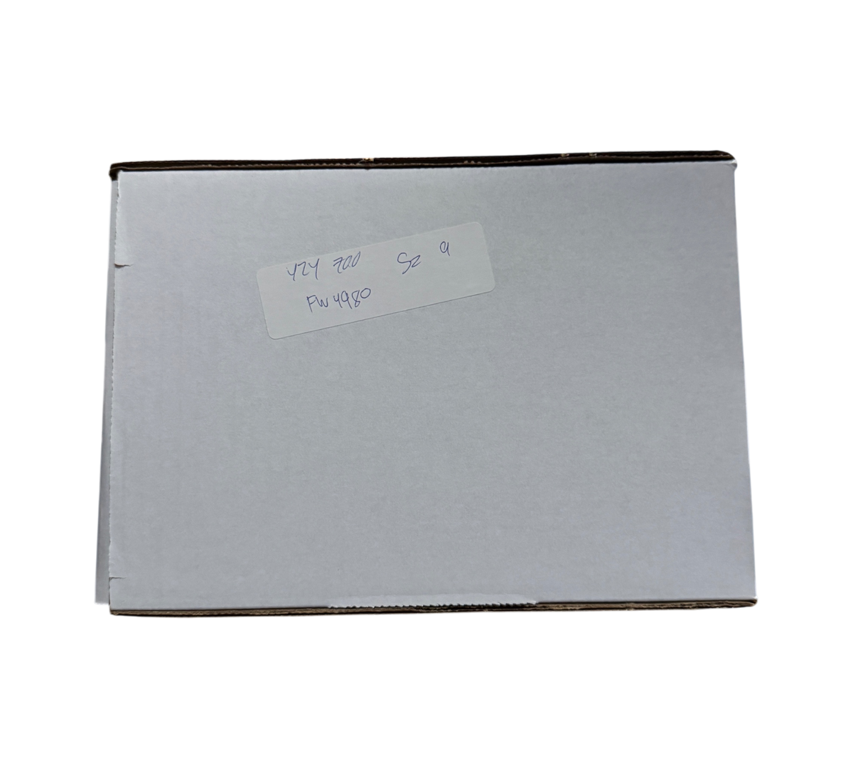 Genesis Boutique white cardboard shipping box with handwritten label for Yeezy 700 Azael size 9 in a warehouse