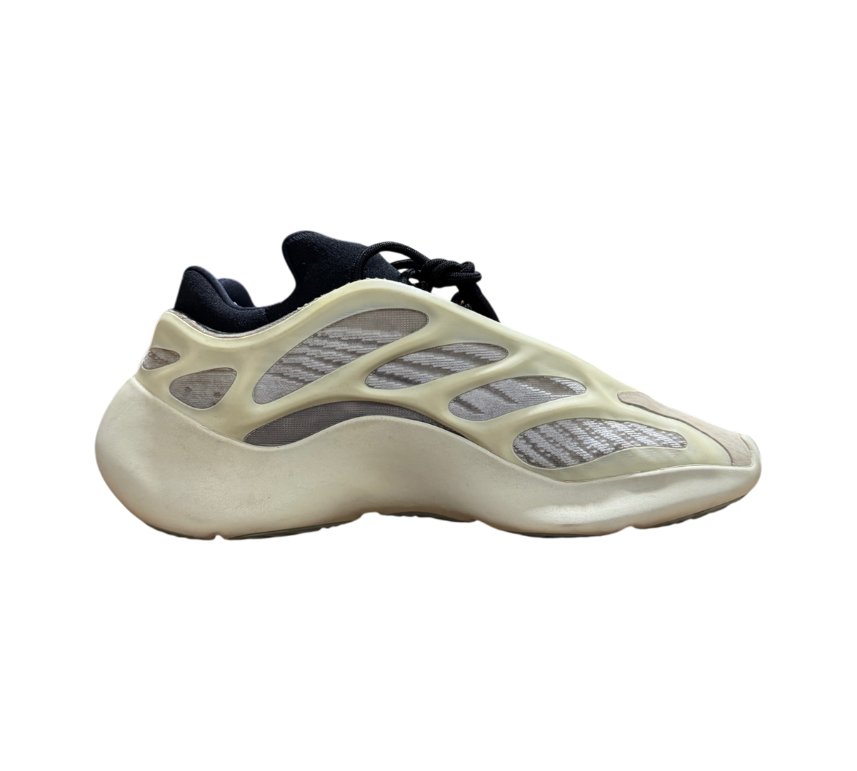 Genesis Boutique used Yeezy 700 Azael sneakers in off-white and black, featuring a unique cage design.